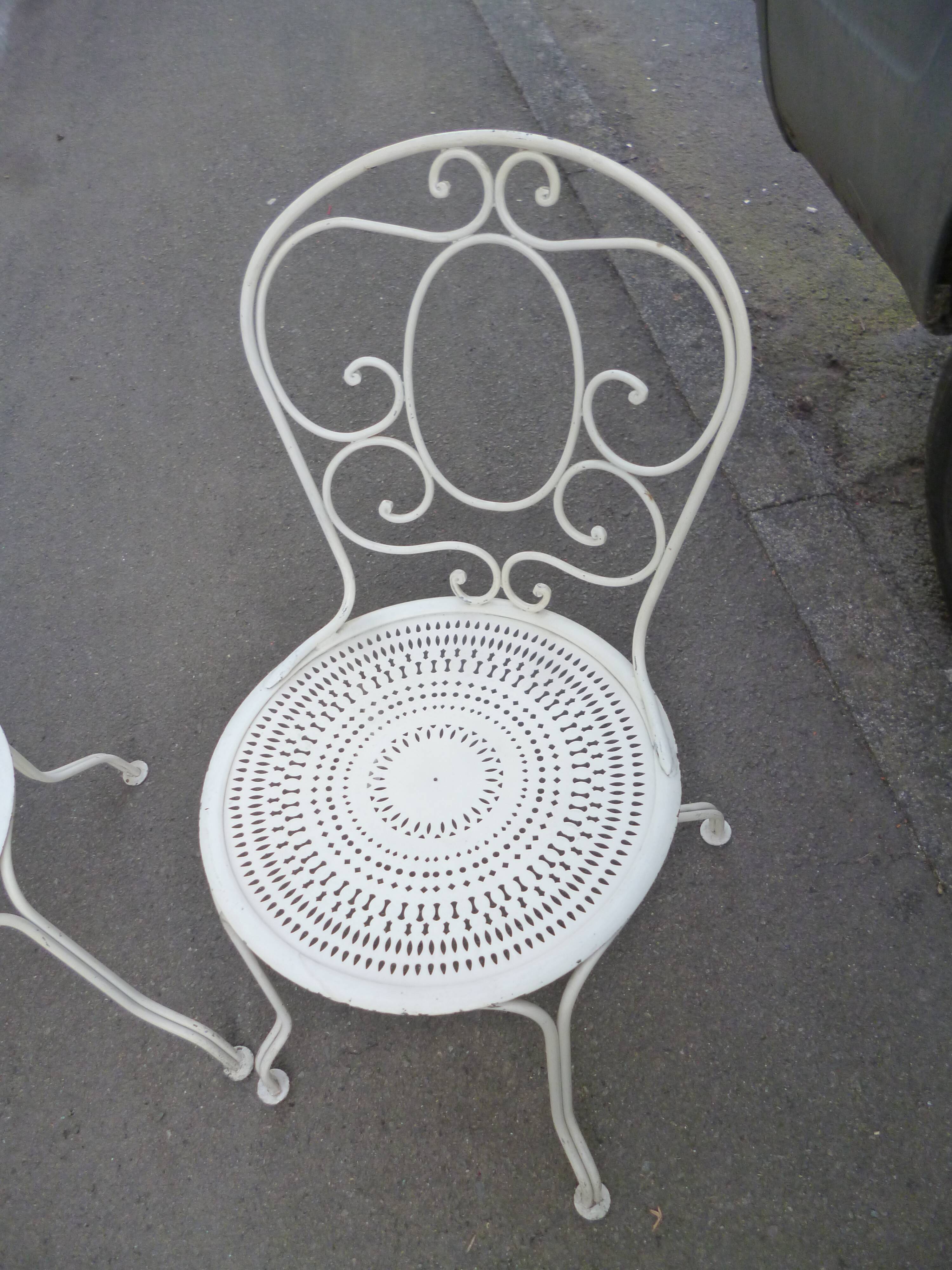 Pair of old wrought iron garden chairs