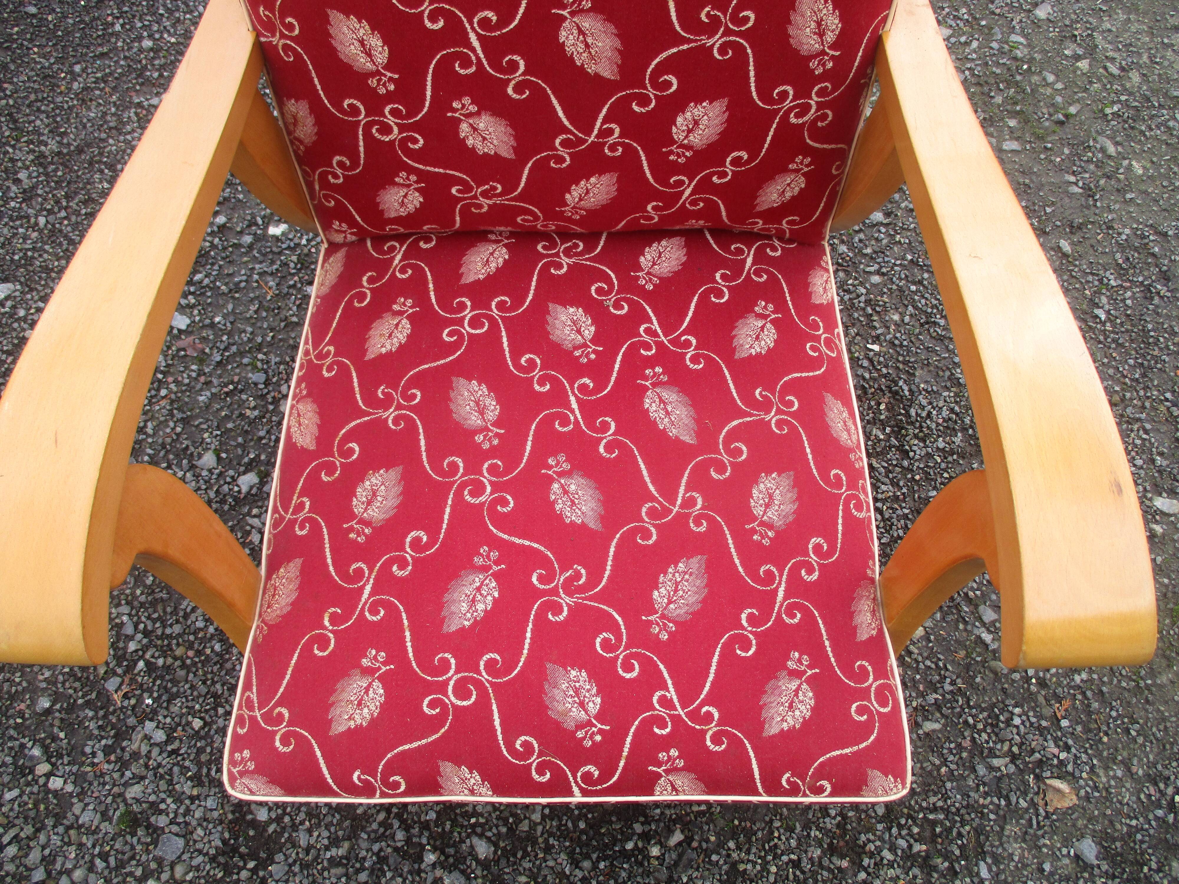 Scandinavian armchair in wood and red fabric