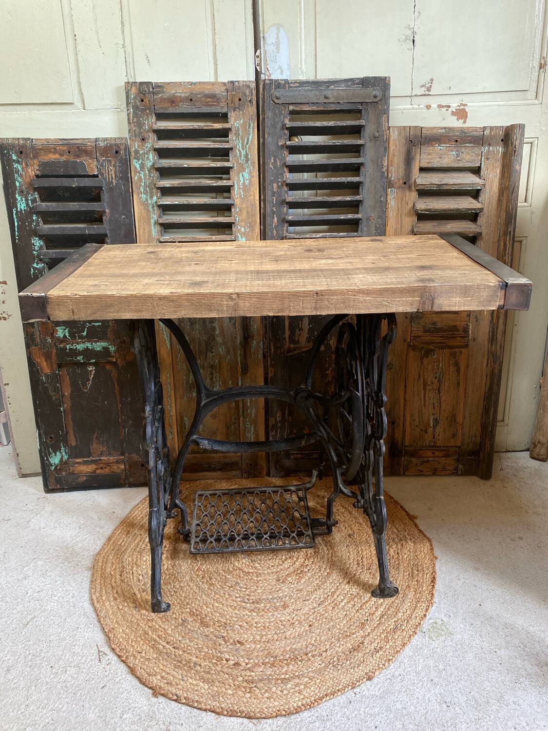 Vintage wooden table with a cast iron base.