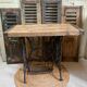 Vintage wooden table with a cast iron base.