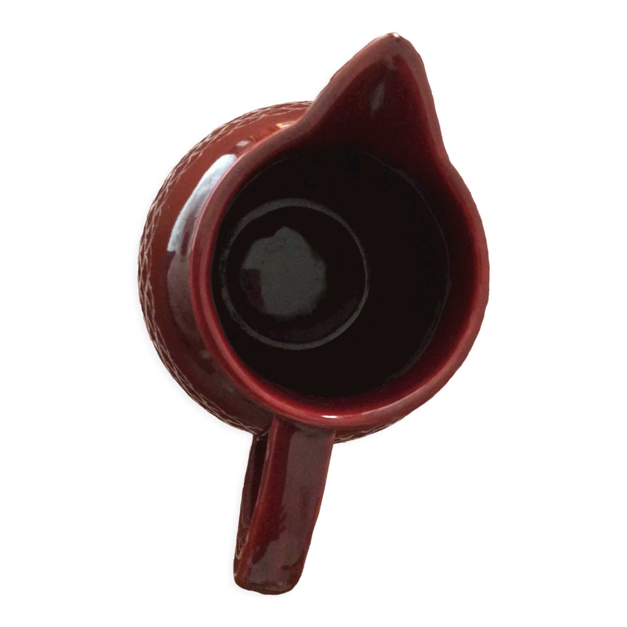 Old dark red ceramic pitcher jug