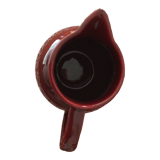 Old dark red ceramic pitcher jug