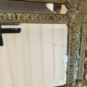 Small mirror with repoussé brass frame.