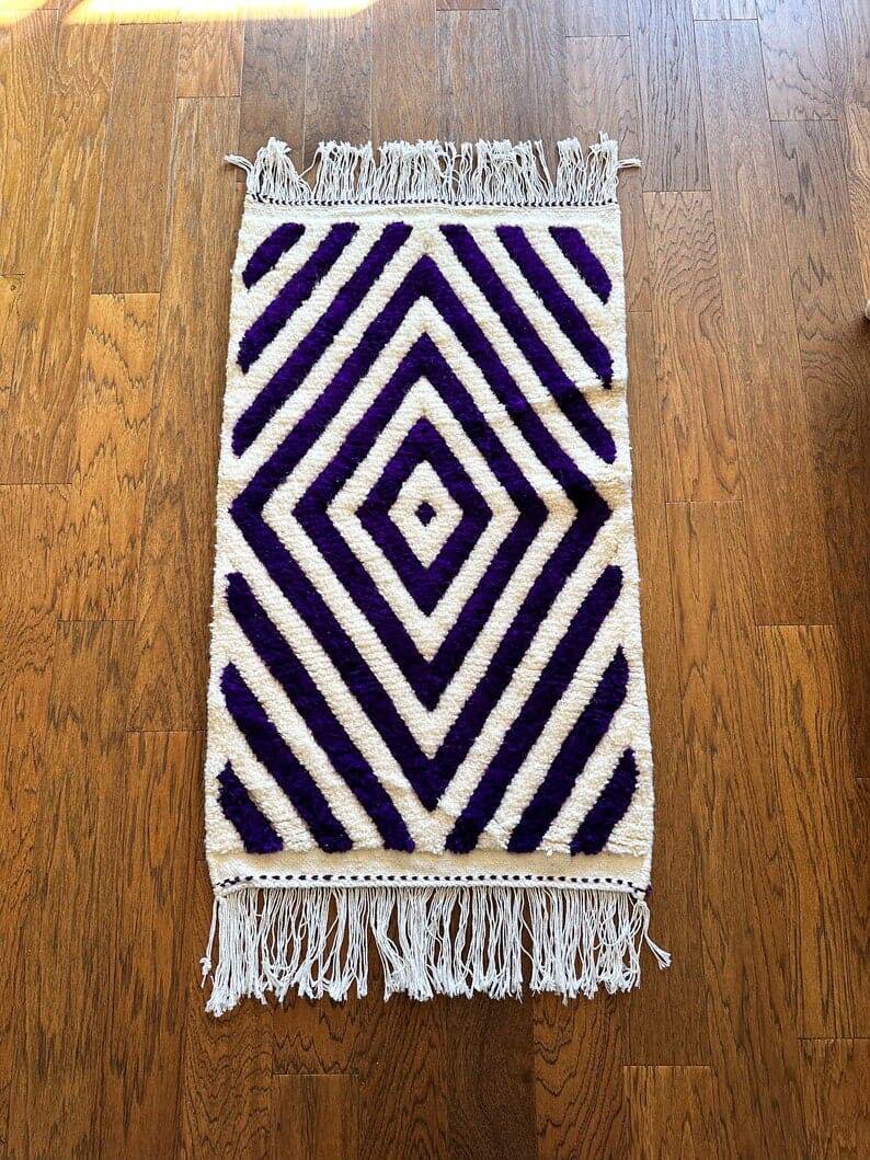Handmade wool rug from Moroccan Atlas, size 140 x 260 cm.