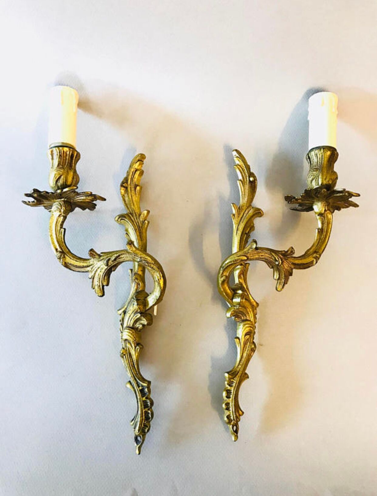 A pair of rococo gilded wall lights