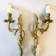 A pair of rococo gilded wall lights