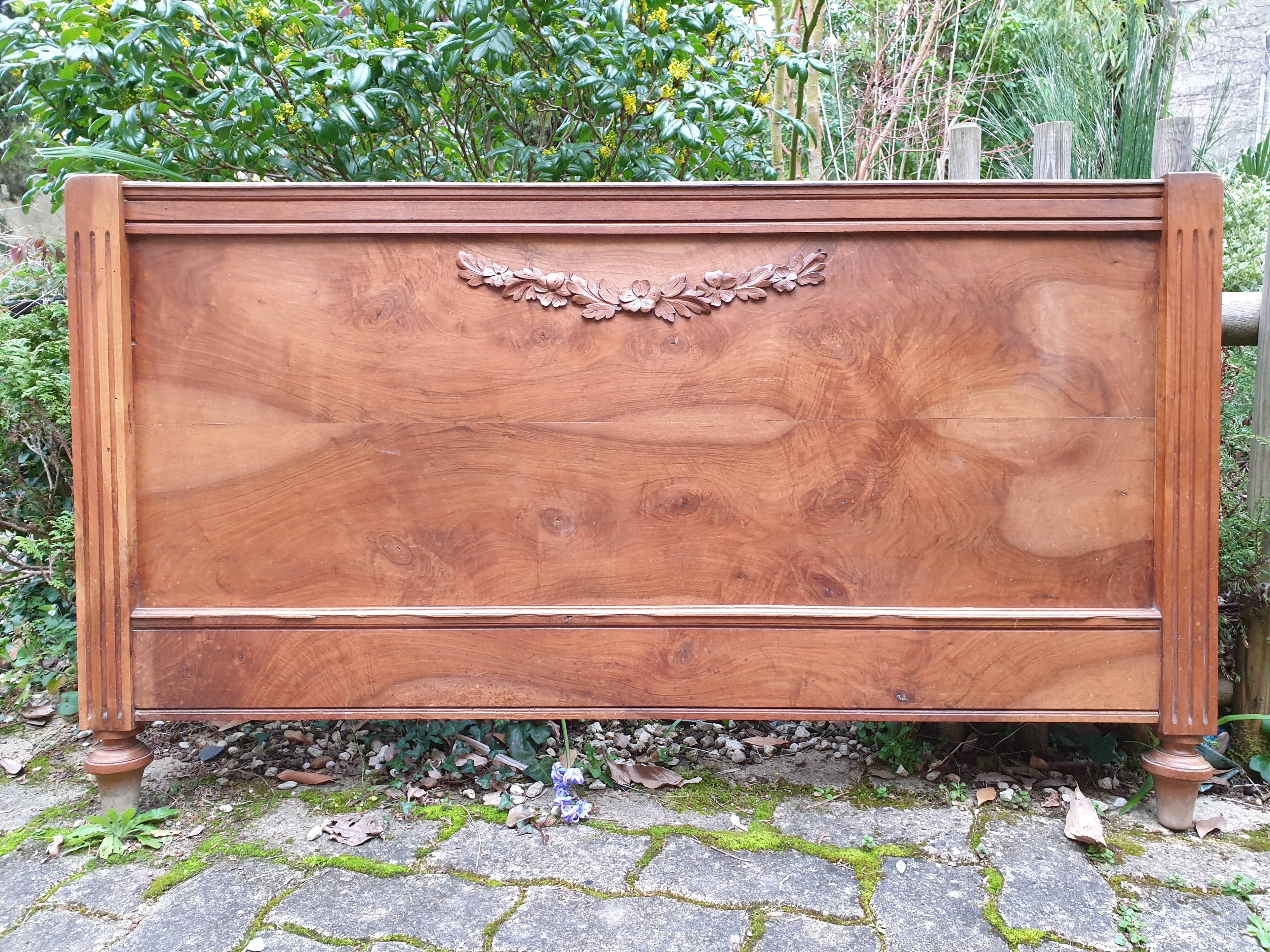 Carved walnut headboard