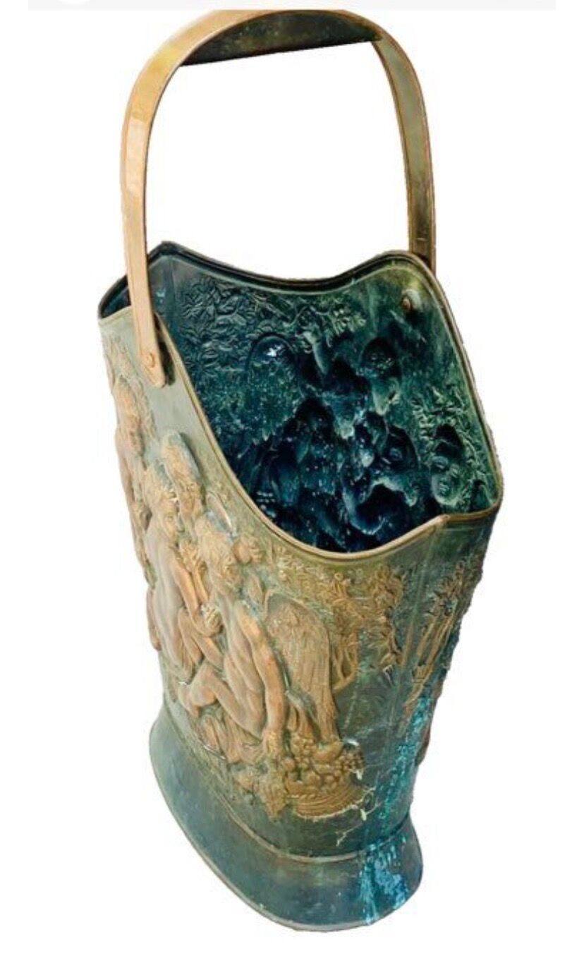 Antique red copper umbrella stand decorated with putti angels.