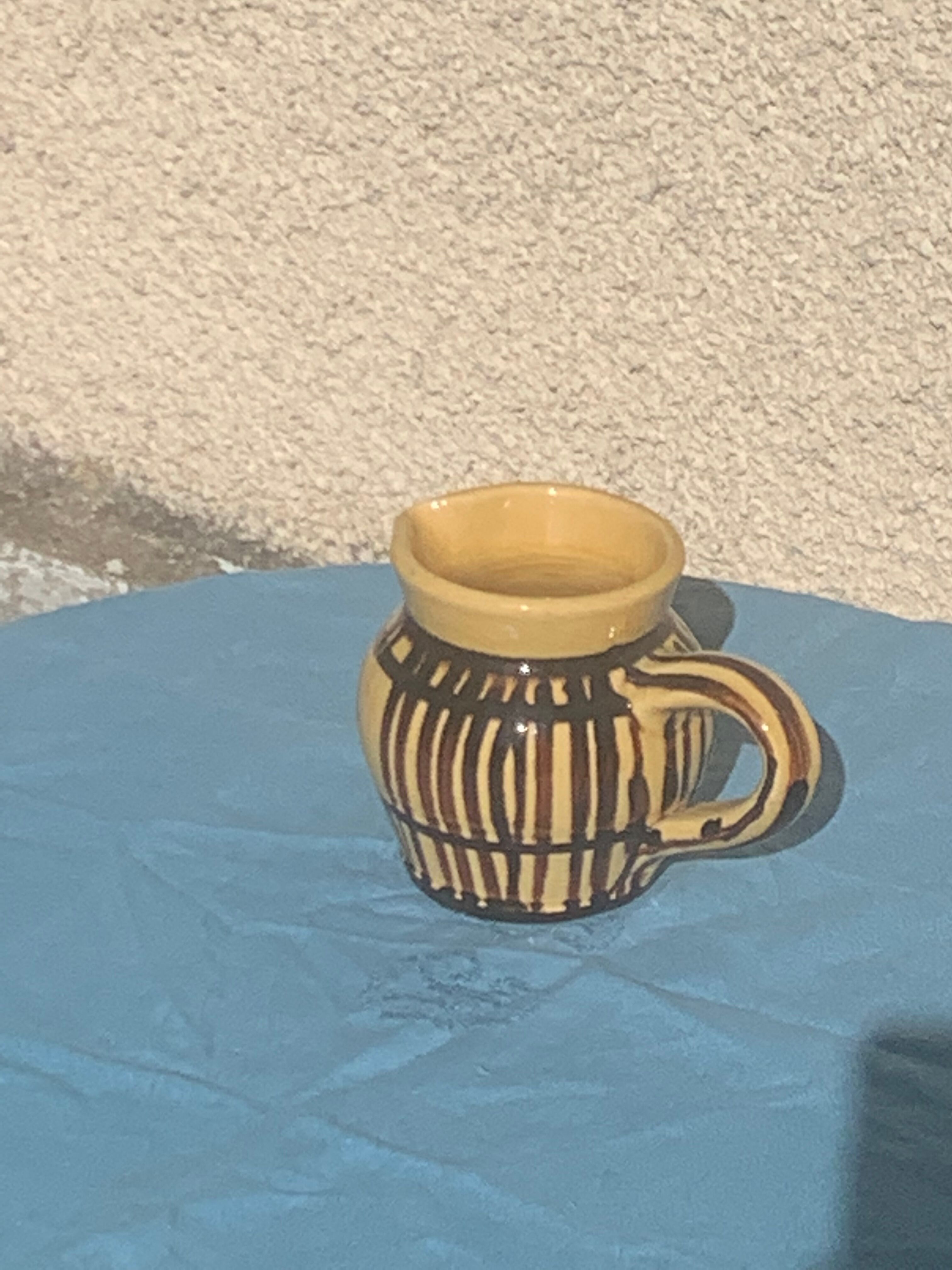 Vintage prince henry enamelled ceramic pitcher