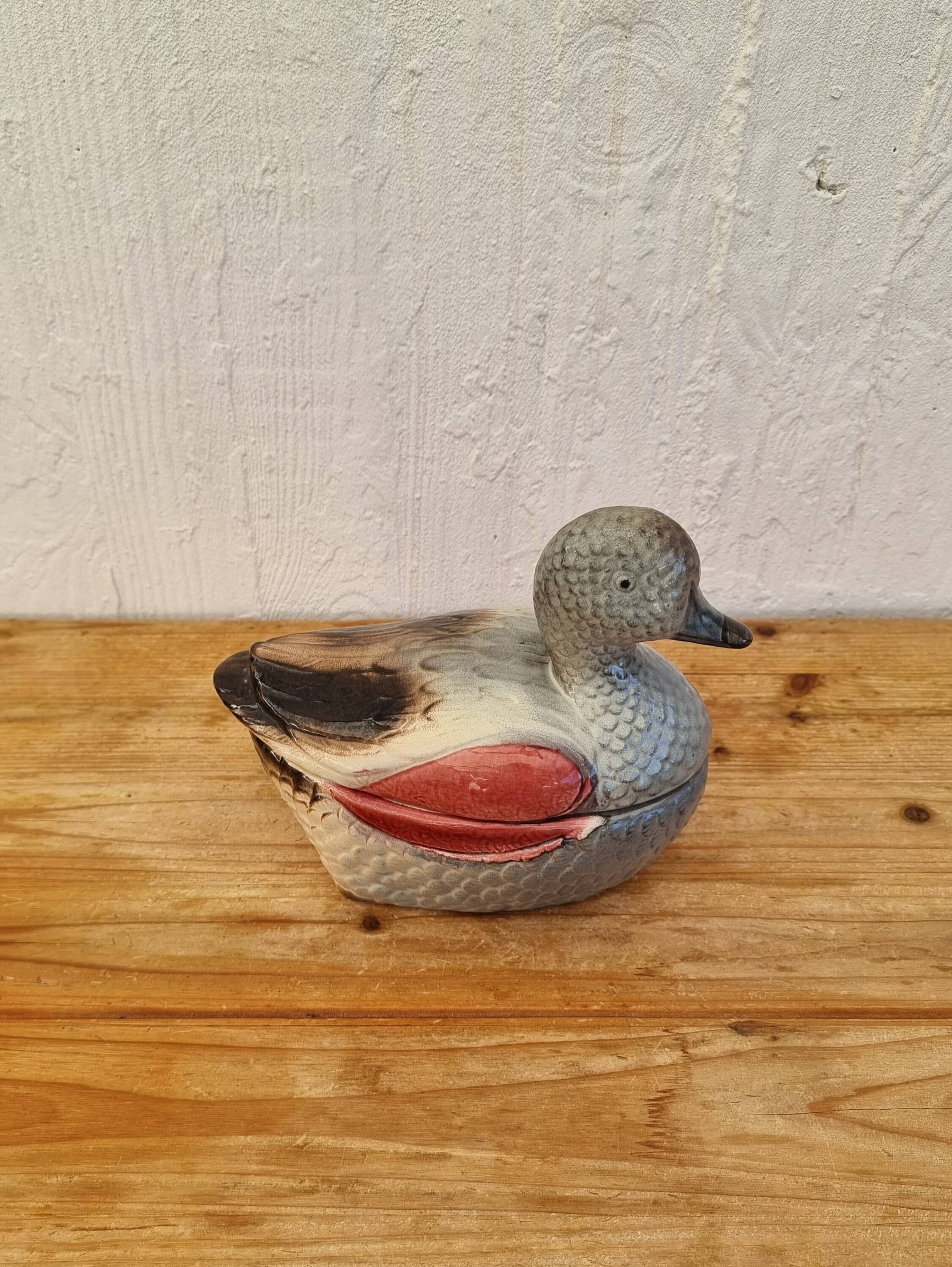 Antique earthenware terrine in the shape of a duck.