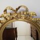 Louis XVI-style gilded wooden oval mirror