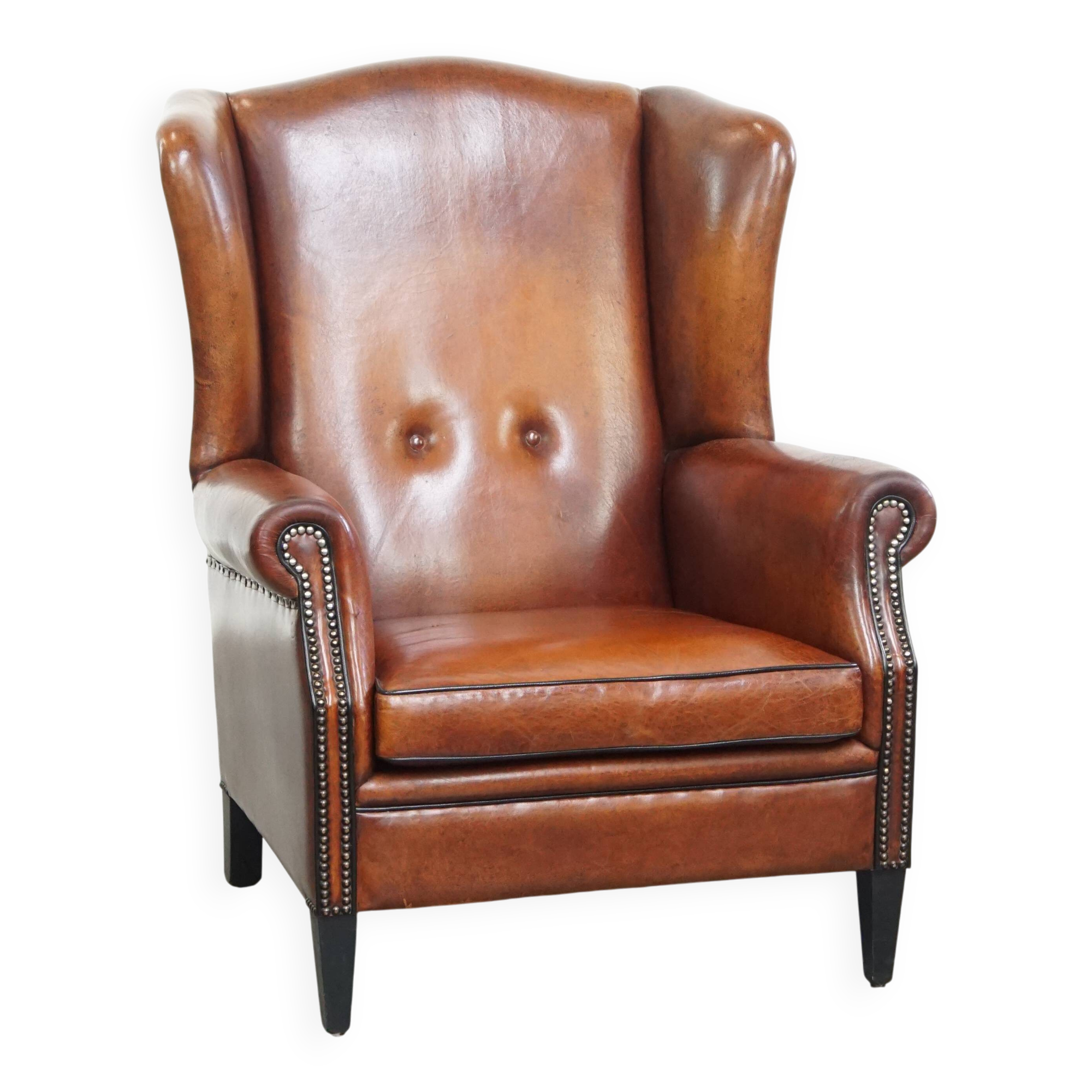 Sheepskin Wingback Chair with Warm Tones and Black Piping