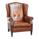 Sheepskin Wingback Chair with Warm Tones and Black Piping