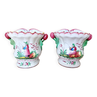 Pair of enameled earthenware flower girls