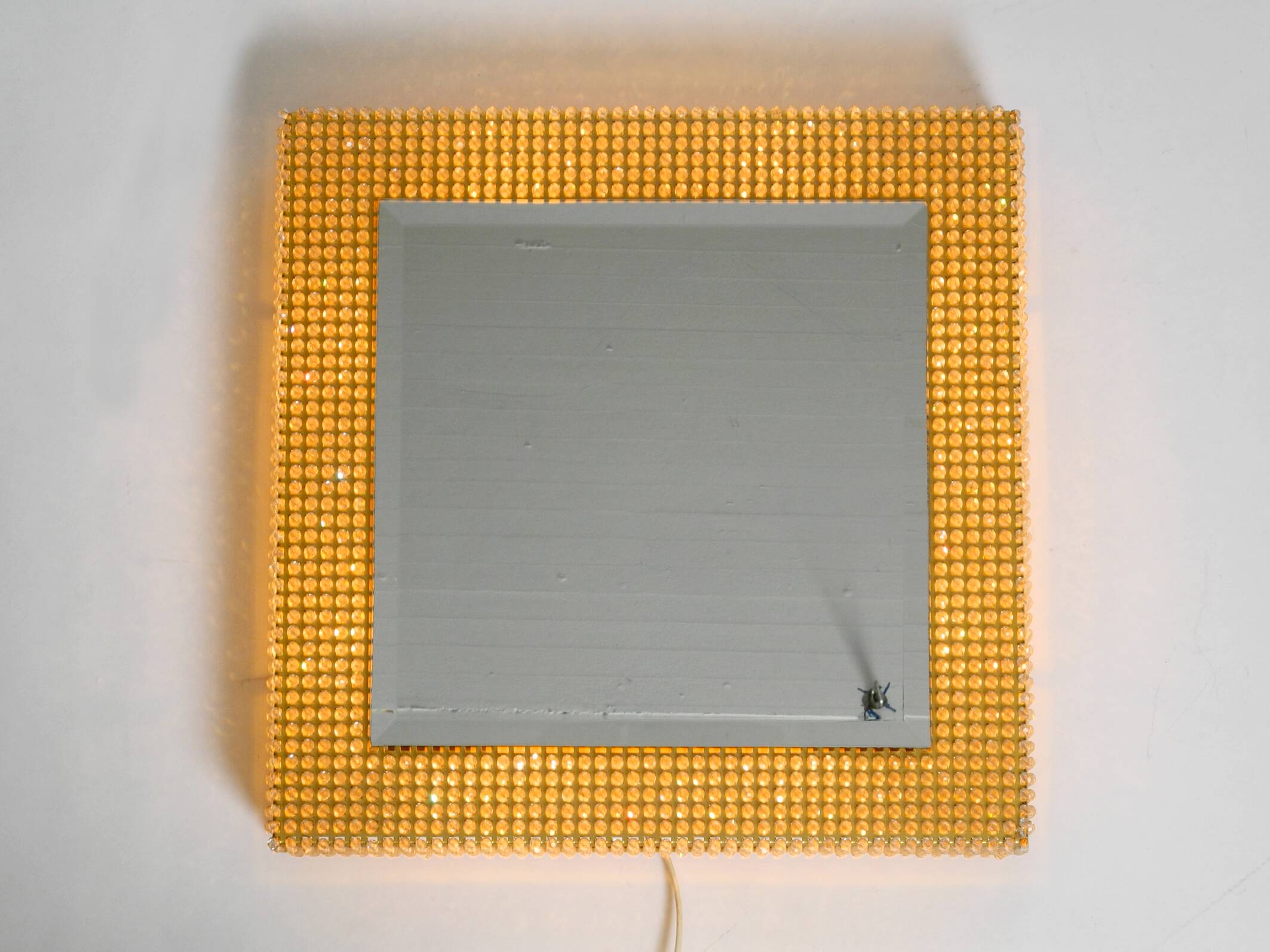 1960s brass wall backlit mirror, frame with glass beads by Palwa