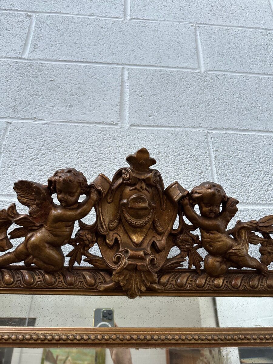 19th-century mirror with cherubs