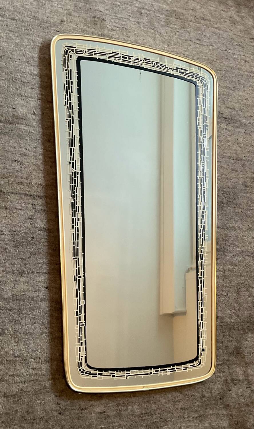 Asymmetrical free-form mirror from the 1970s