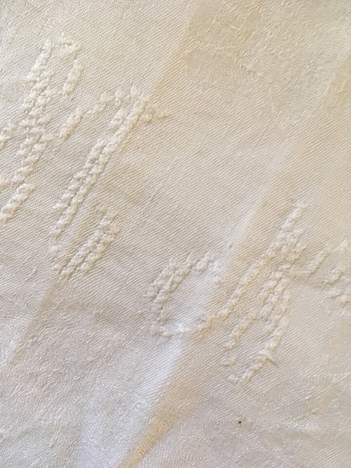 Six damask white towels and embroidered M N.