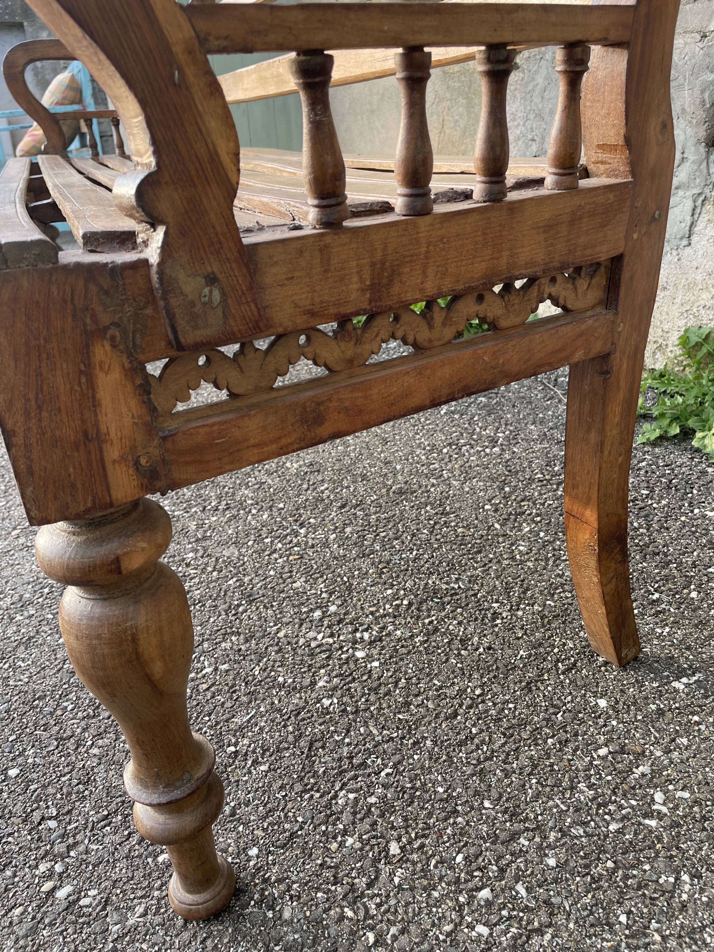 Carved teak bench