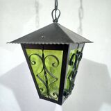 Wrought iron and green glass lantern