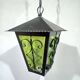 Wrought iron and green glass lantern