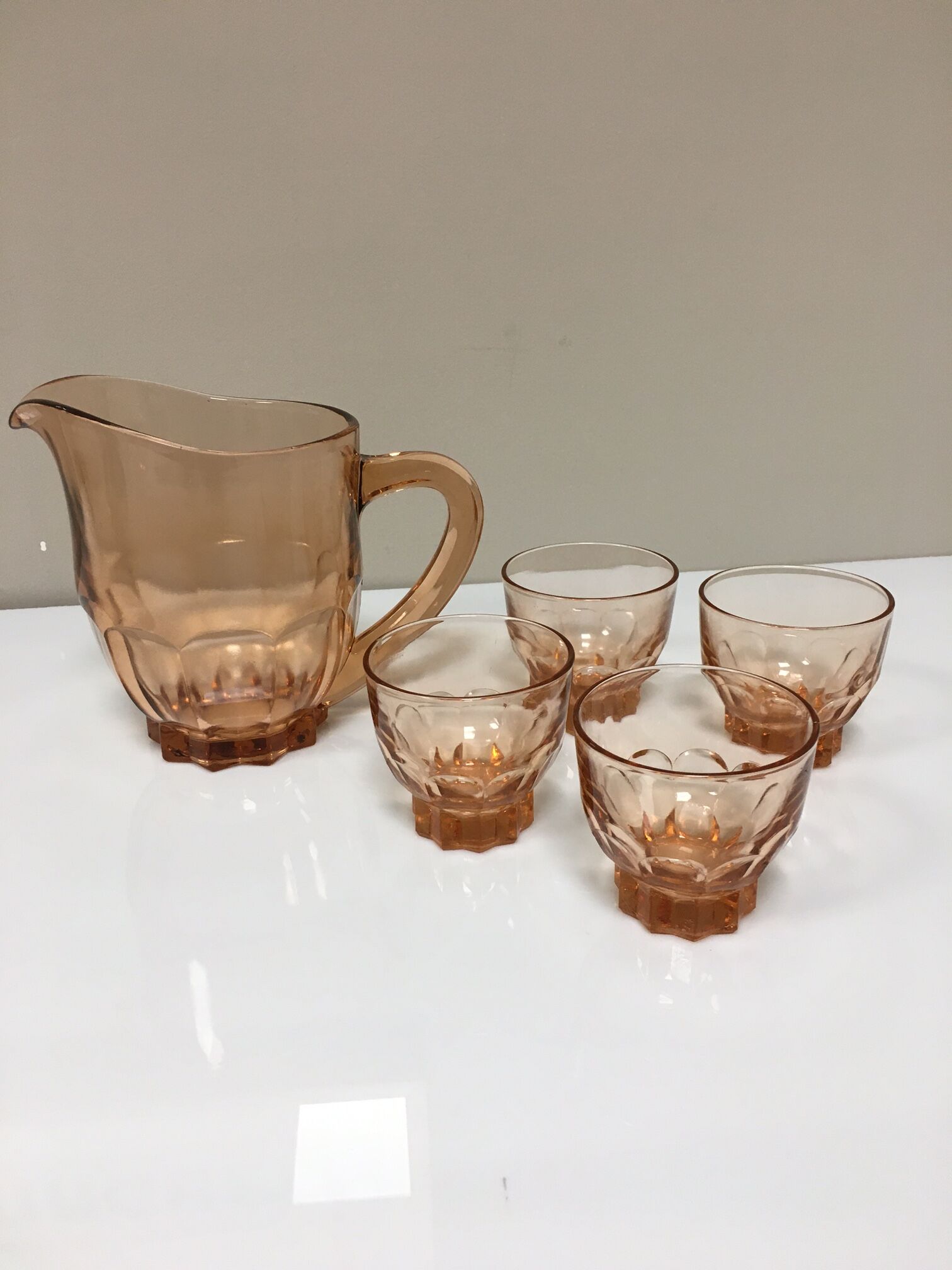 Orange pitcher and 4 rosaline glasses