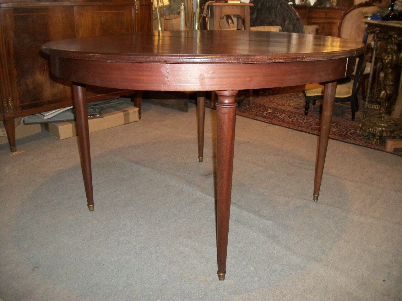Oval mahogany table with extension cords
