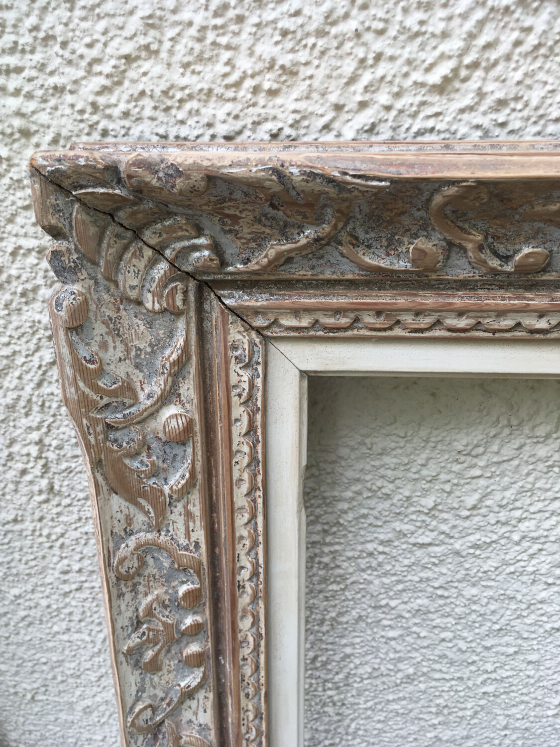 Carved wood frame.