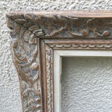 Carved wood frame.
