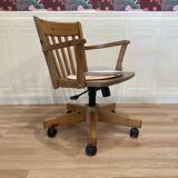 Solid wood swivel and reclining armchair.