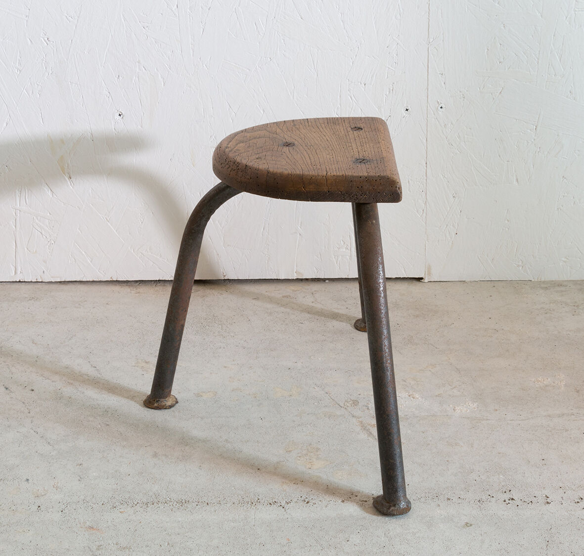 Wooden and tripod metal stool