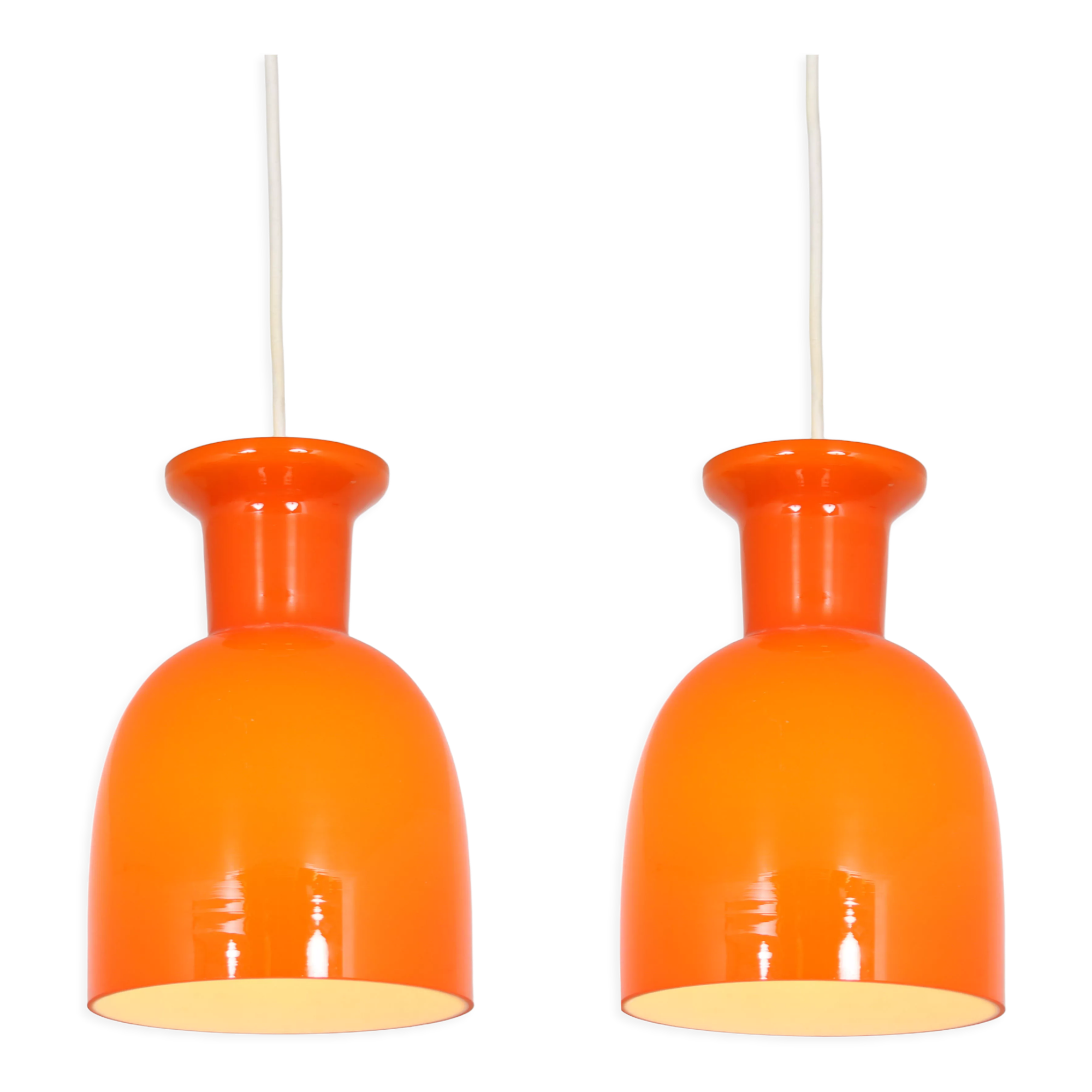 Pair of orange hanging lamps by Raak, the Netherlands, 1970