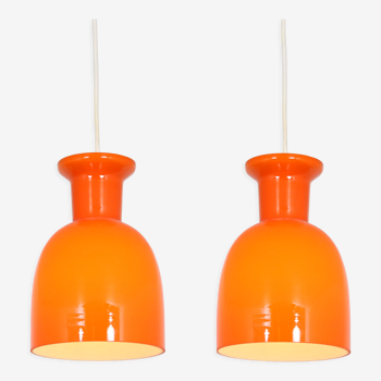 Pair of orange hanging lamps by Raak, the Netherlands, 1970