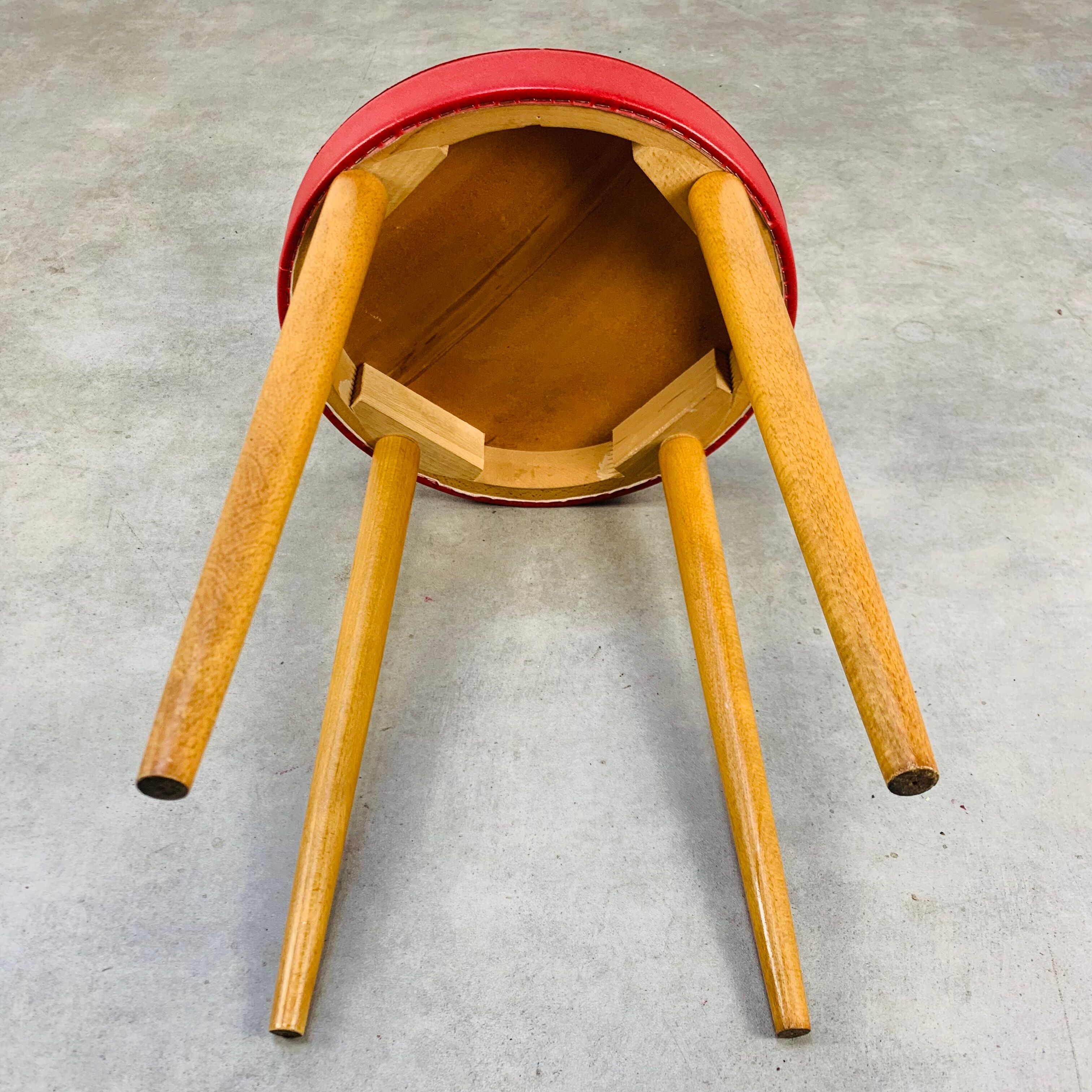 Baumann bistro stool wood and imitation red leather 60s
