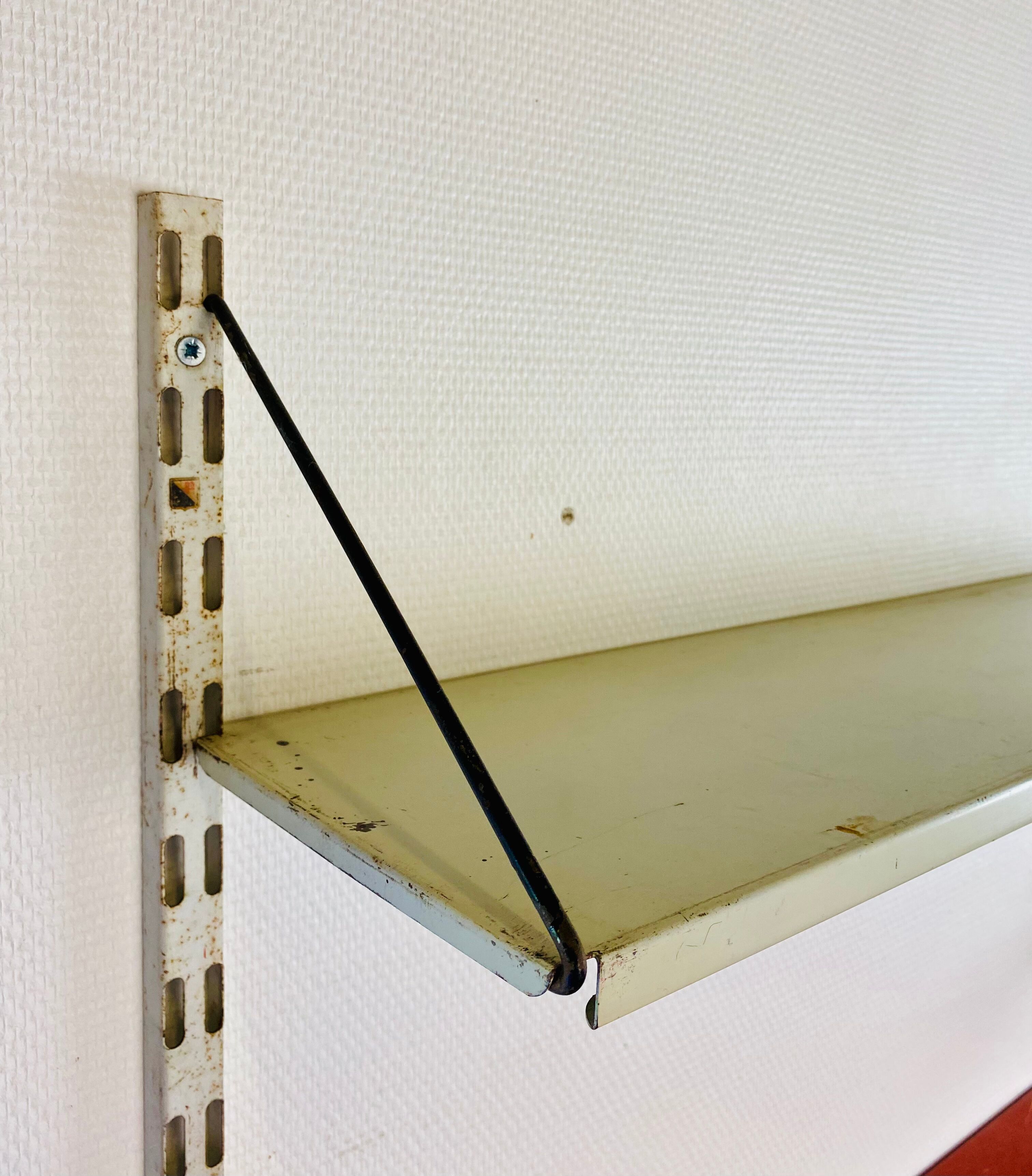 Shelf system, wall, metal, Pilastro edition.