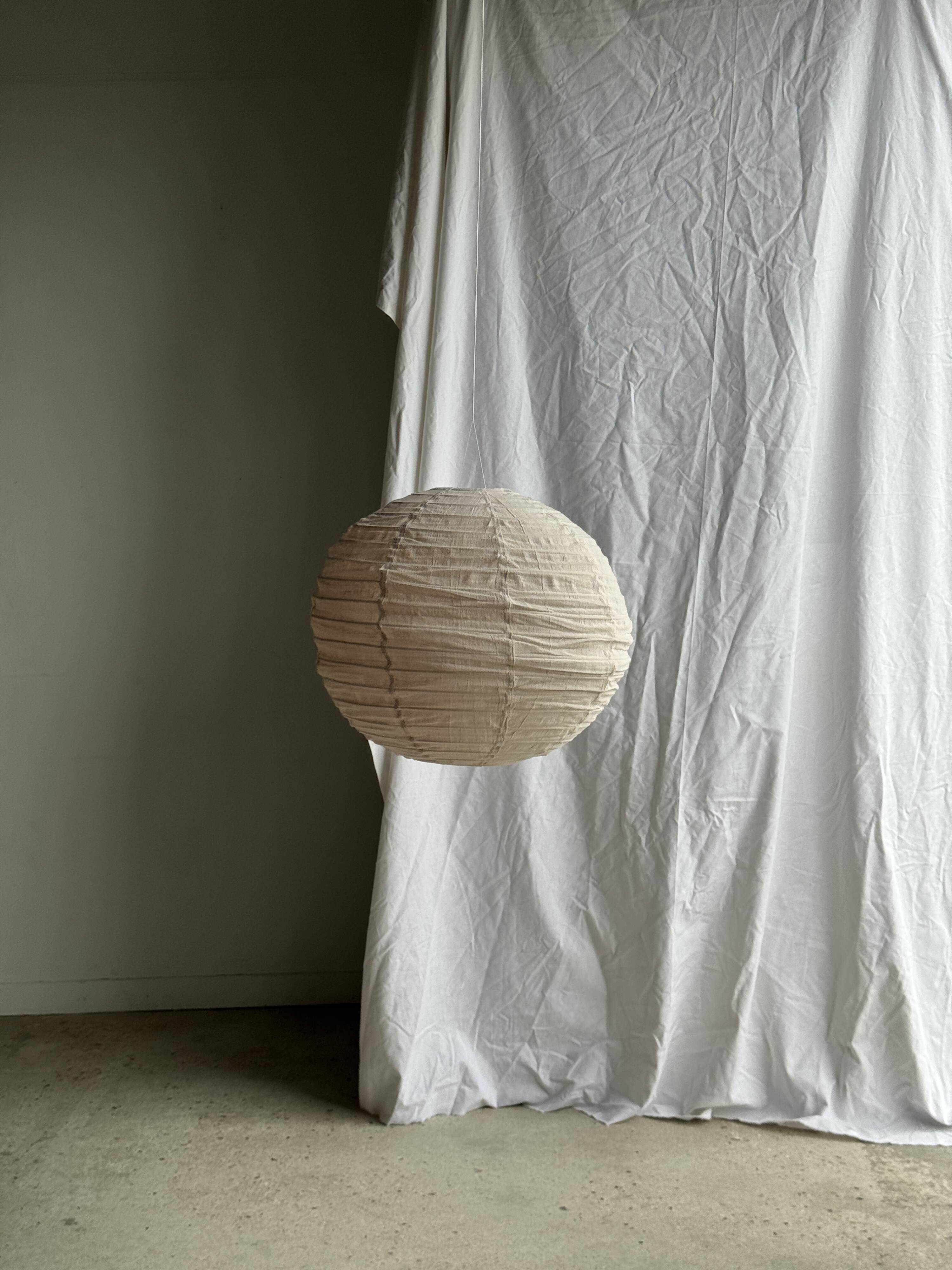 Large round pink Japanese-style suspension made of rattan and natural linen D60.