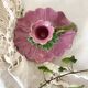 Antique slip candlestick depicting a flower
