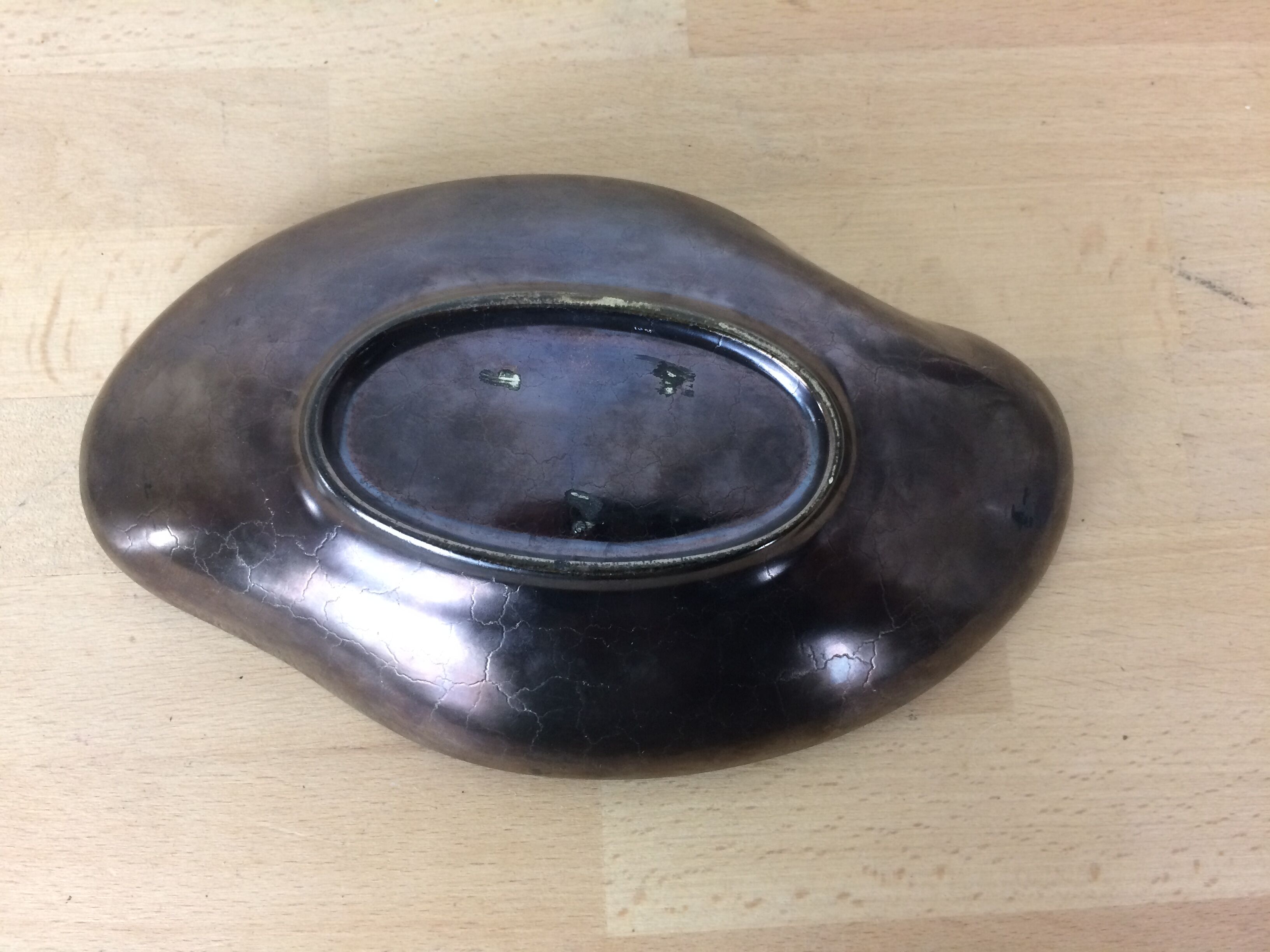 Empty black and red ceramic Elchinger pocket