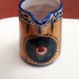 Small milk jug signed AR-H