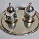 Deux coquetiers sous cloche en métal argenté avec plateau de présentation "Gombault", 28 cm