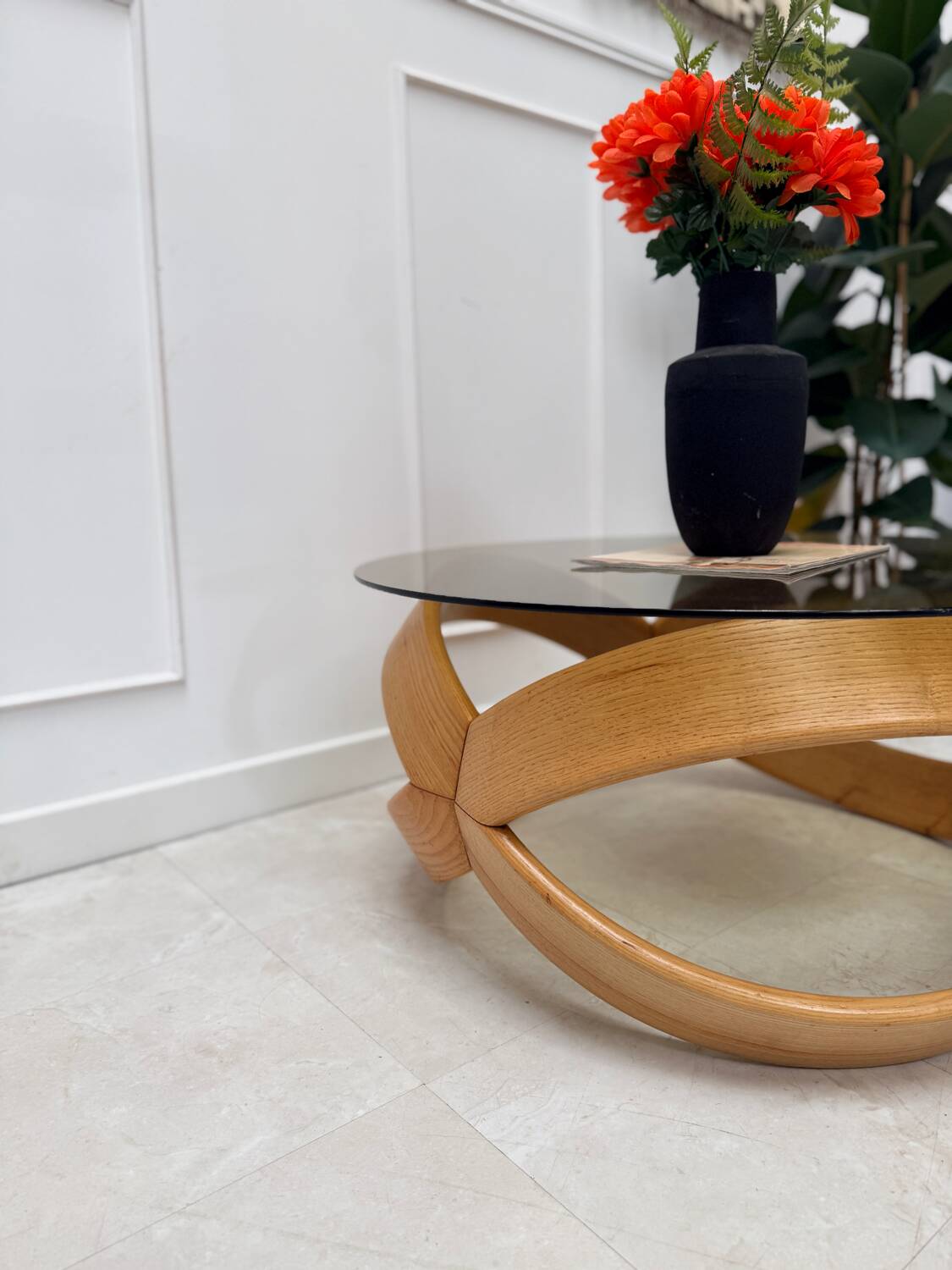 Smoked glass and curved wood coffee table