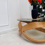 Smoked glass and curved wood coffee table