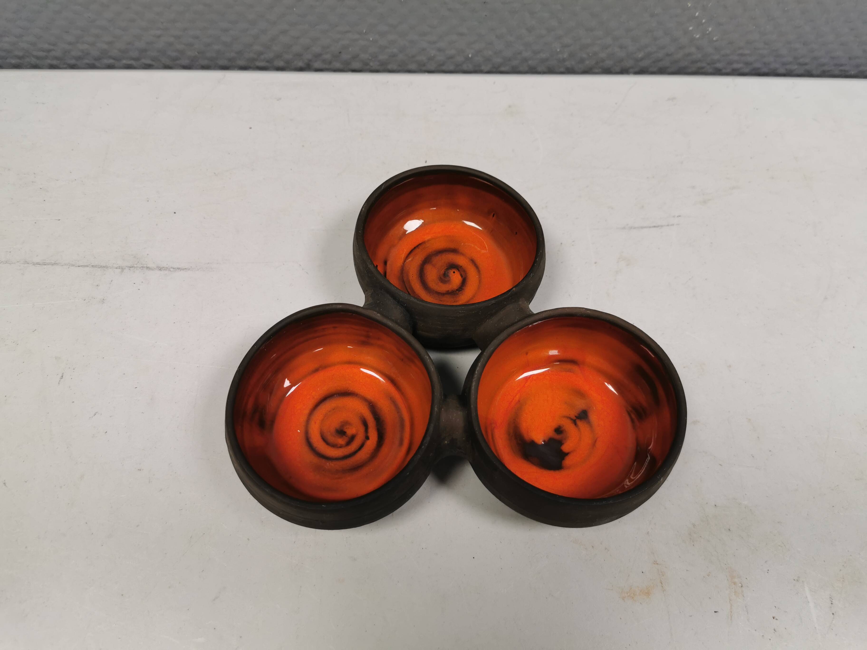 Beautiful bowl (composed of 3 bowls) with orange/red glaze inside