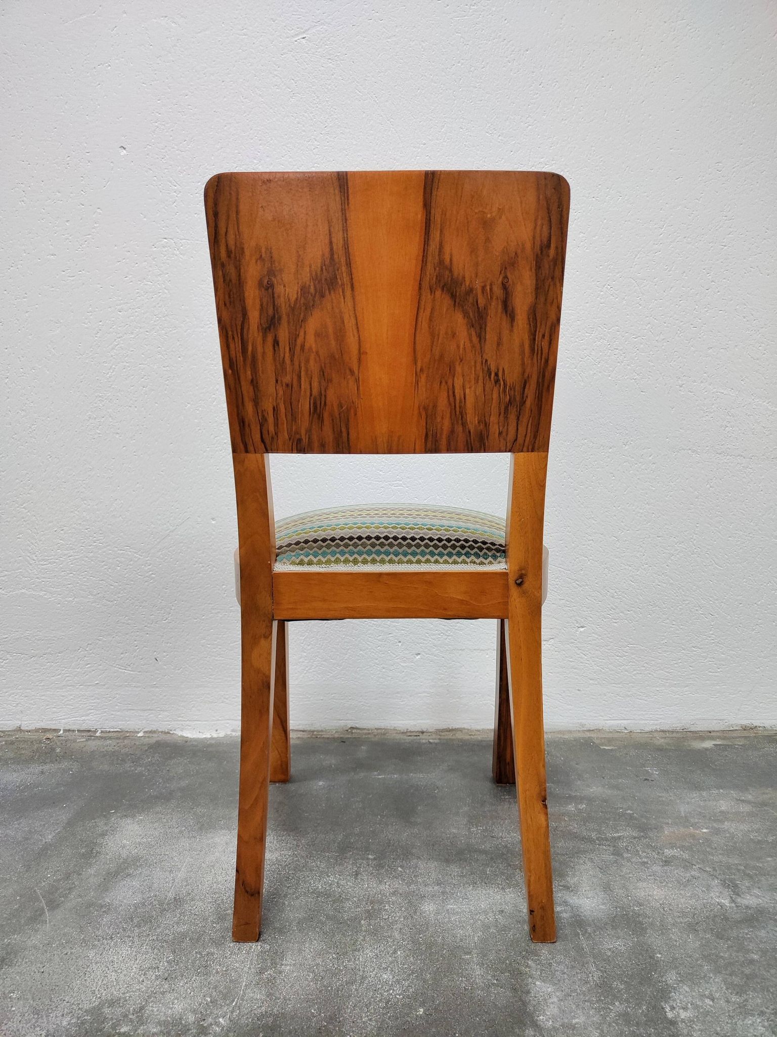 Set of six Art Deco dining chairs in walnut root veneer, 1940s.