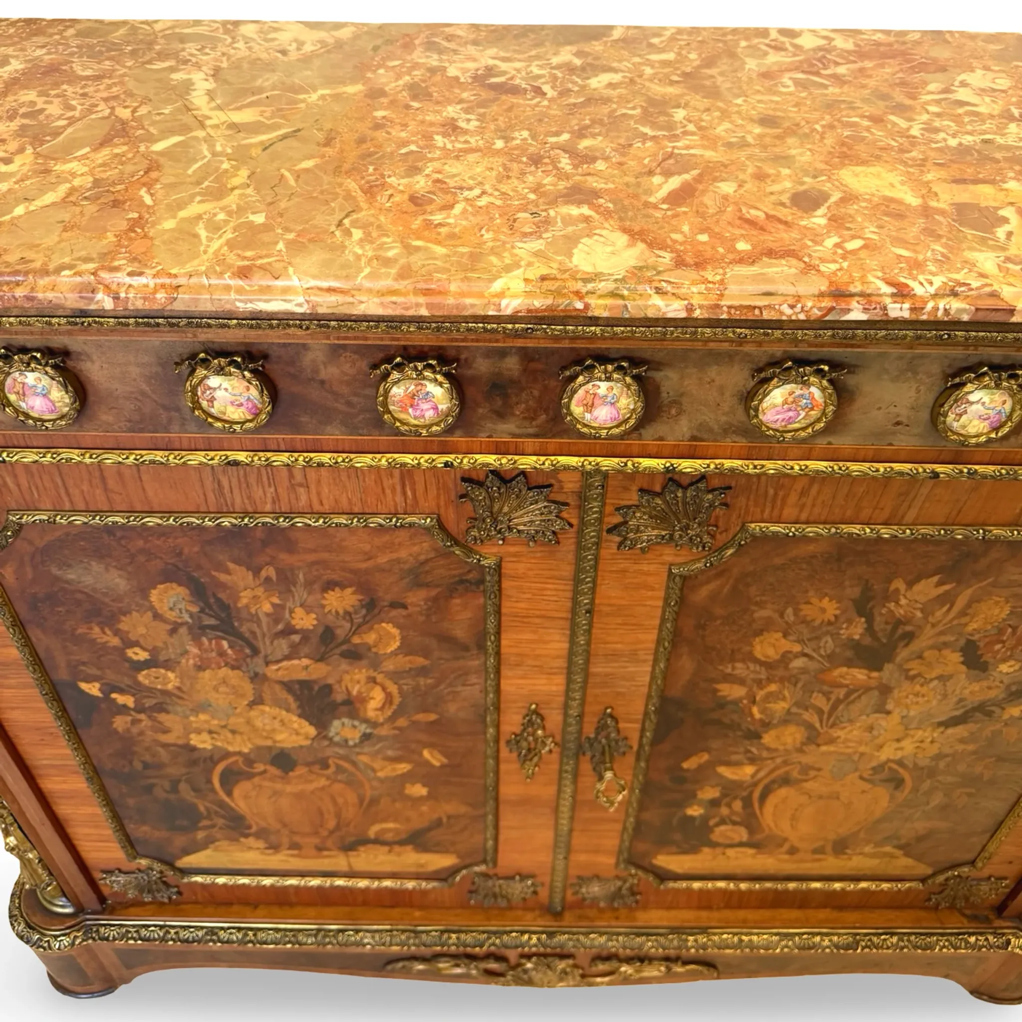An antique French Louis XVI-style marble-top side cabinet