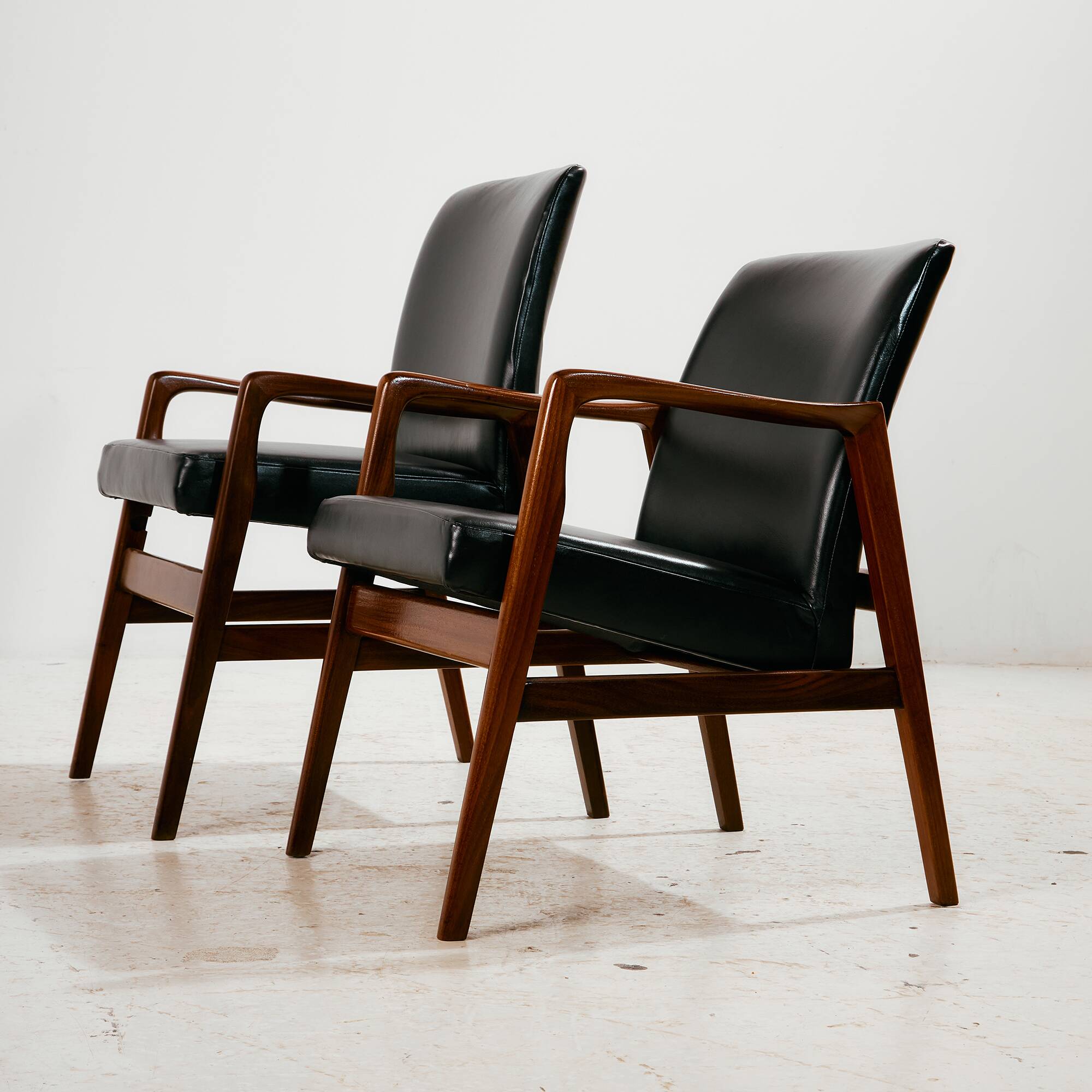 Teak armchair with leather upholstery