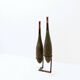 Pair of large wooden practice skittles on a base, early 20th century
