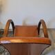 Paire de fauteuils studio simili cuir marron années 30