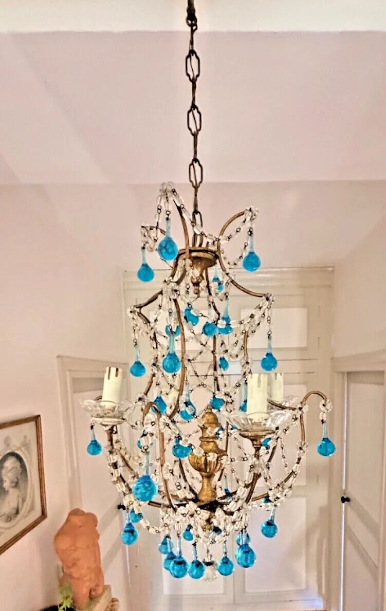 Italian chandelier with blue beads and gilded wood.