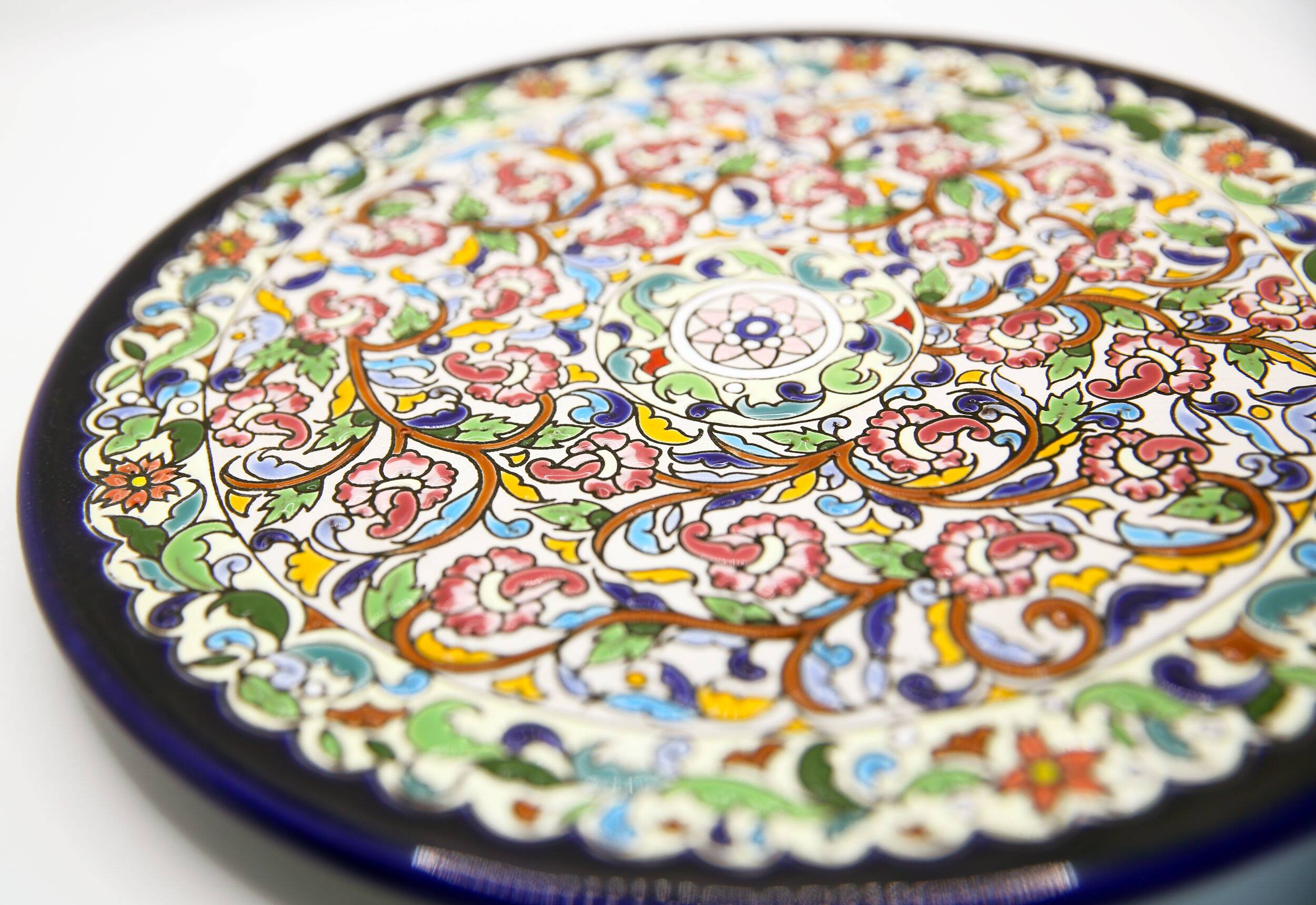 Handmade dish with multicolored enamelled flowers